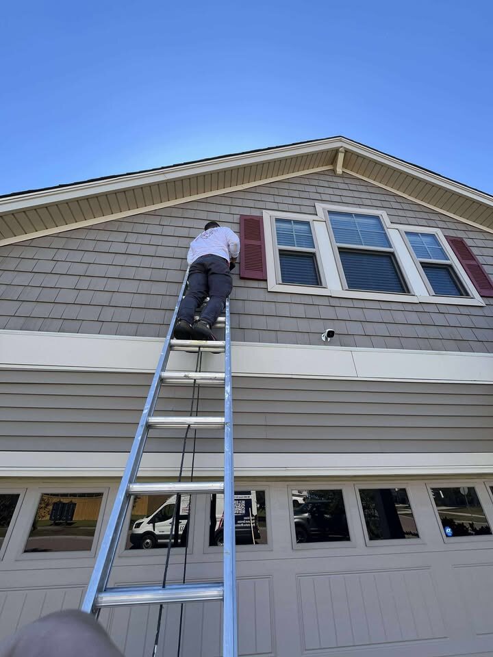 MBH team member working from a ladder during routine home care